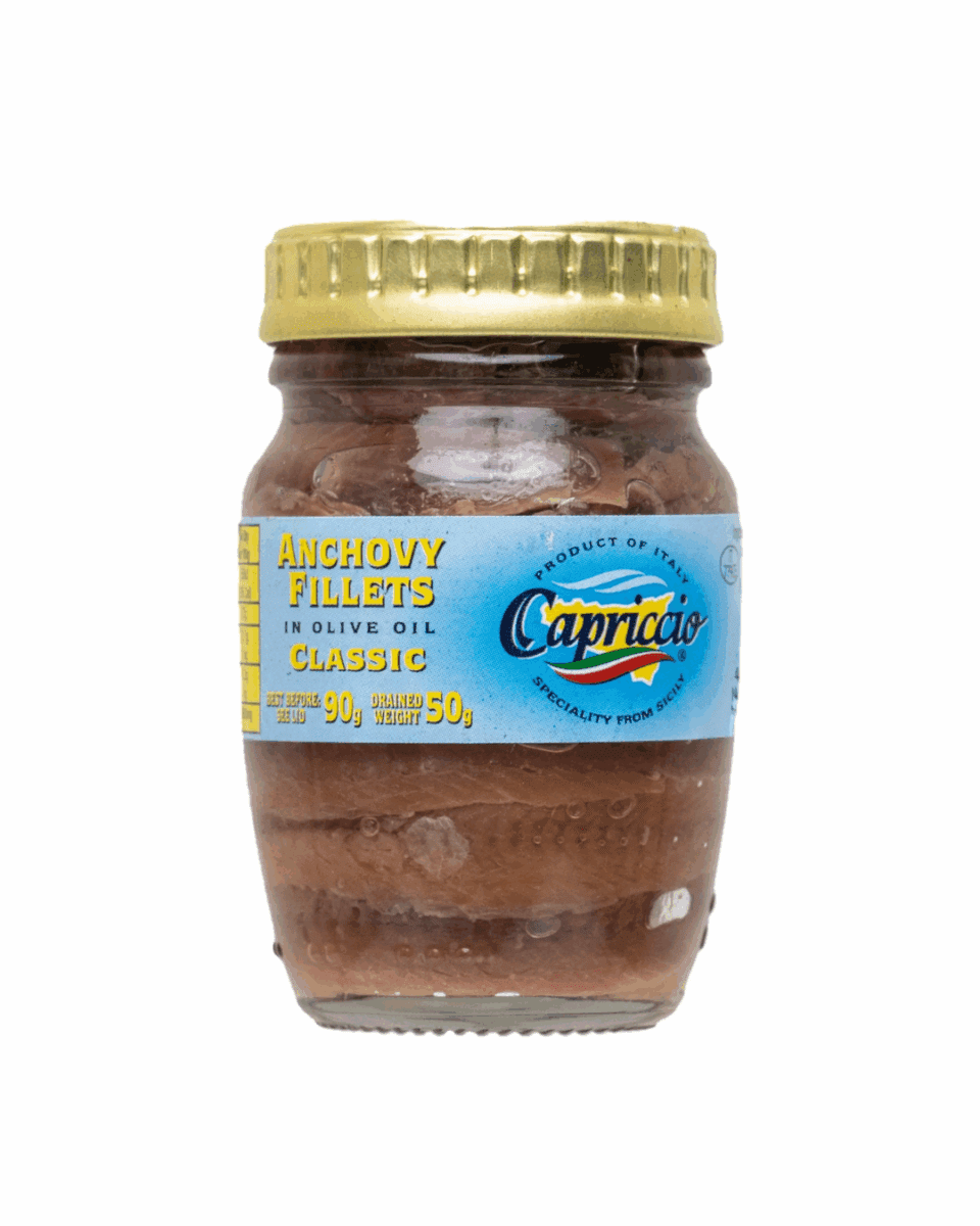 Glass jar of Italian anchovy fillets in olive oil with a yellow lid and blue label.