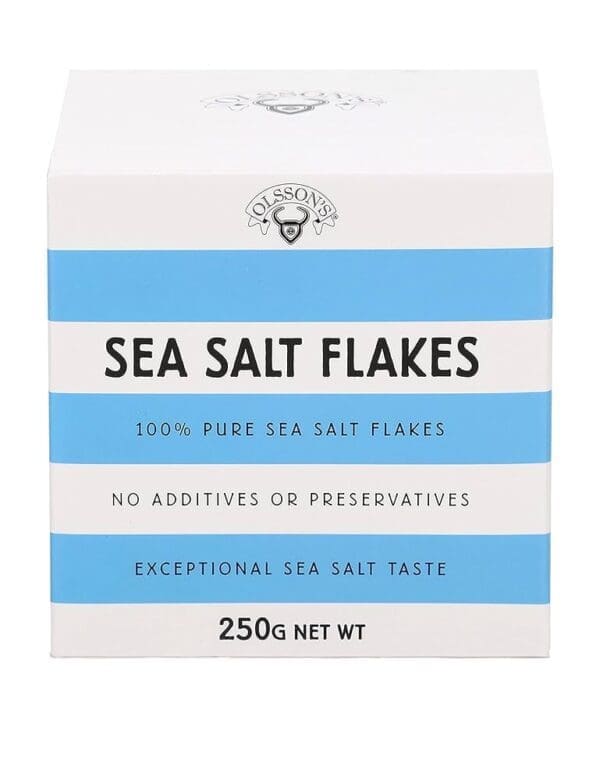 White and blue box of Olsson's Sea Salt Flakes, 250g, pure with no additives or preservatives.