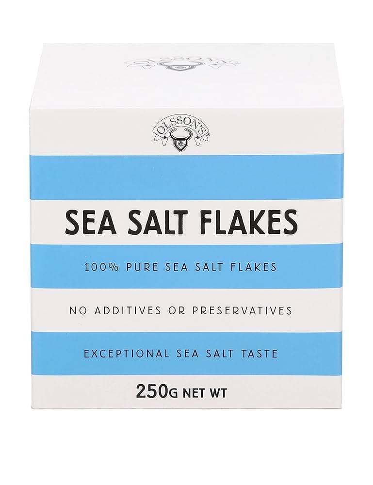 White and blue box of Olsson's Sea Salt Flakes, 250g, pure with no additives or preservatives.