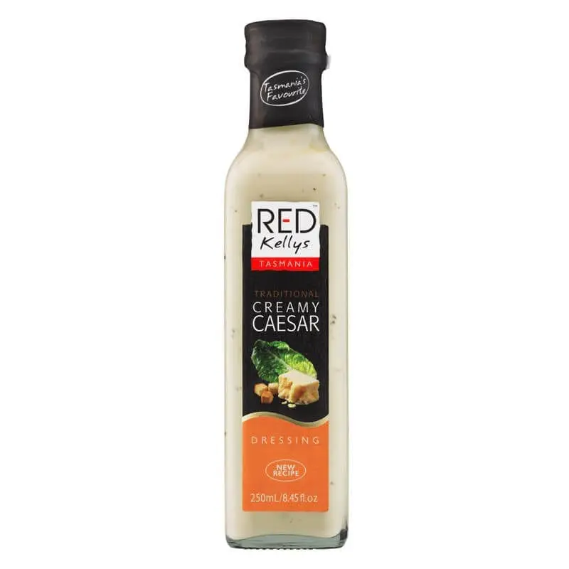 250ml Red Kellys Tasmania Creamy Caesar dressing, black cap, lettuce, and croutons on label.