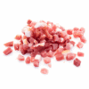 Small diced bacon pieces, uncooked, showing pink meat and white fat on a white background.
