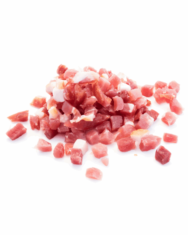 Small diced bacon pieces, uncooked, showing pink meat and white fat on a white background.