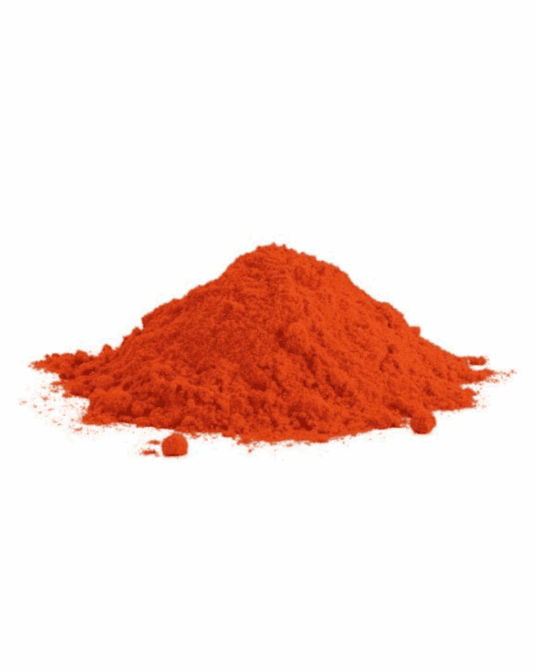 Bright orange powder mound on white background, finely ground and vibrant in color.