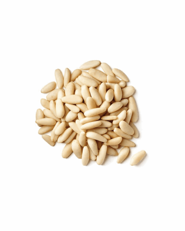 Pile of smooth, pale cream pine nuts on a white background.