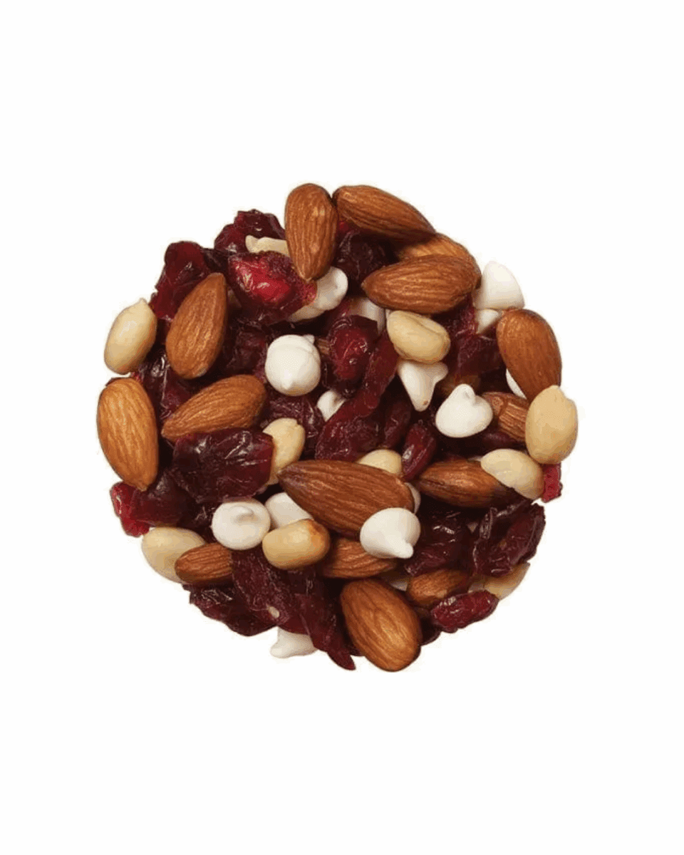 Mix of almonds, dried cranberries, white chocolate chips, and peanuts in circular arrangement.