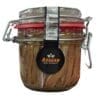 Glass jar with clamp lid, contains anchovy fillets, "Aegean" label, red gasket for sealing.
