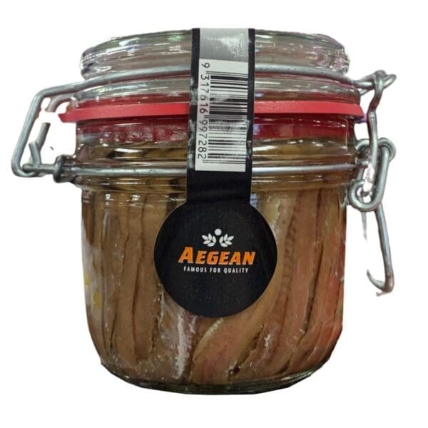 Glass jar with clamp lid, contains anchovy fillets, "Aegean" label, red gasket for sealing.