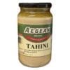 Jar of Aegean tahini, 100% hulled sesame, no preservatives, black lid, green/beige label.