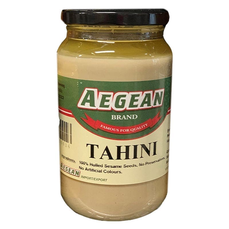Jar of Aegean tahini, 100% hulled sesame, no preservatives, black lid, green/beige label.