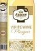 Bottle of Aegean white wine vinegar, golden cap, grapevine label, partial bottle in background.