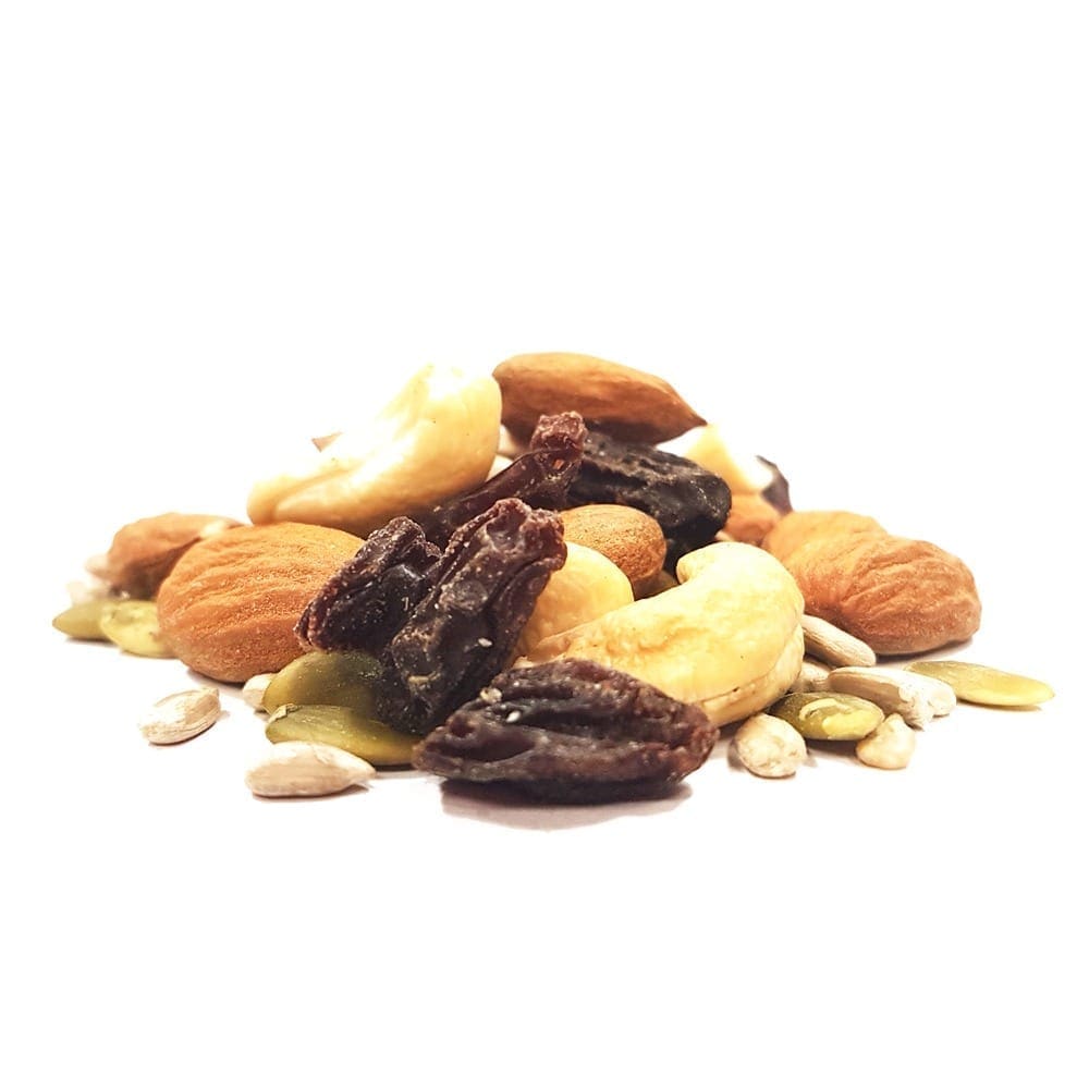 Close-up of almonds, cashews, sunflower and pumpkin seeds, and raisins on white background.