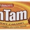 Rectangular pack of Arnott's Tim Tam biscuits, Chewy Caramel flavor, caramel background.