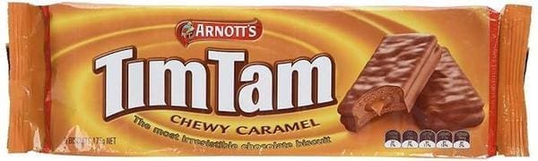 Rectangular pack of Arnott's Tim Tam biscuits, Chewy Caramel flavor, caramel background.