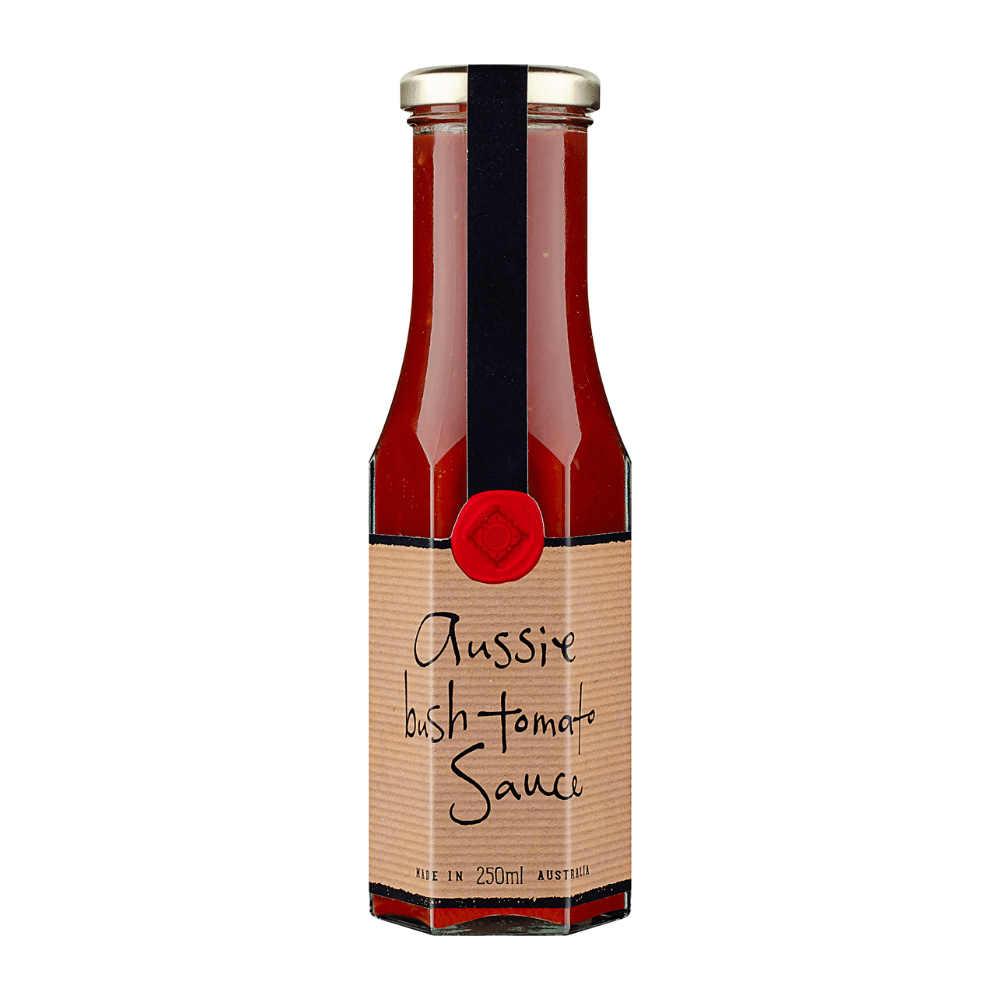 Glass bottle of Aussie Bush Tomato Sauce, 250ml, gold cap, red seal with black ribbon.