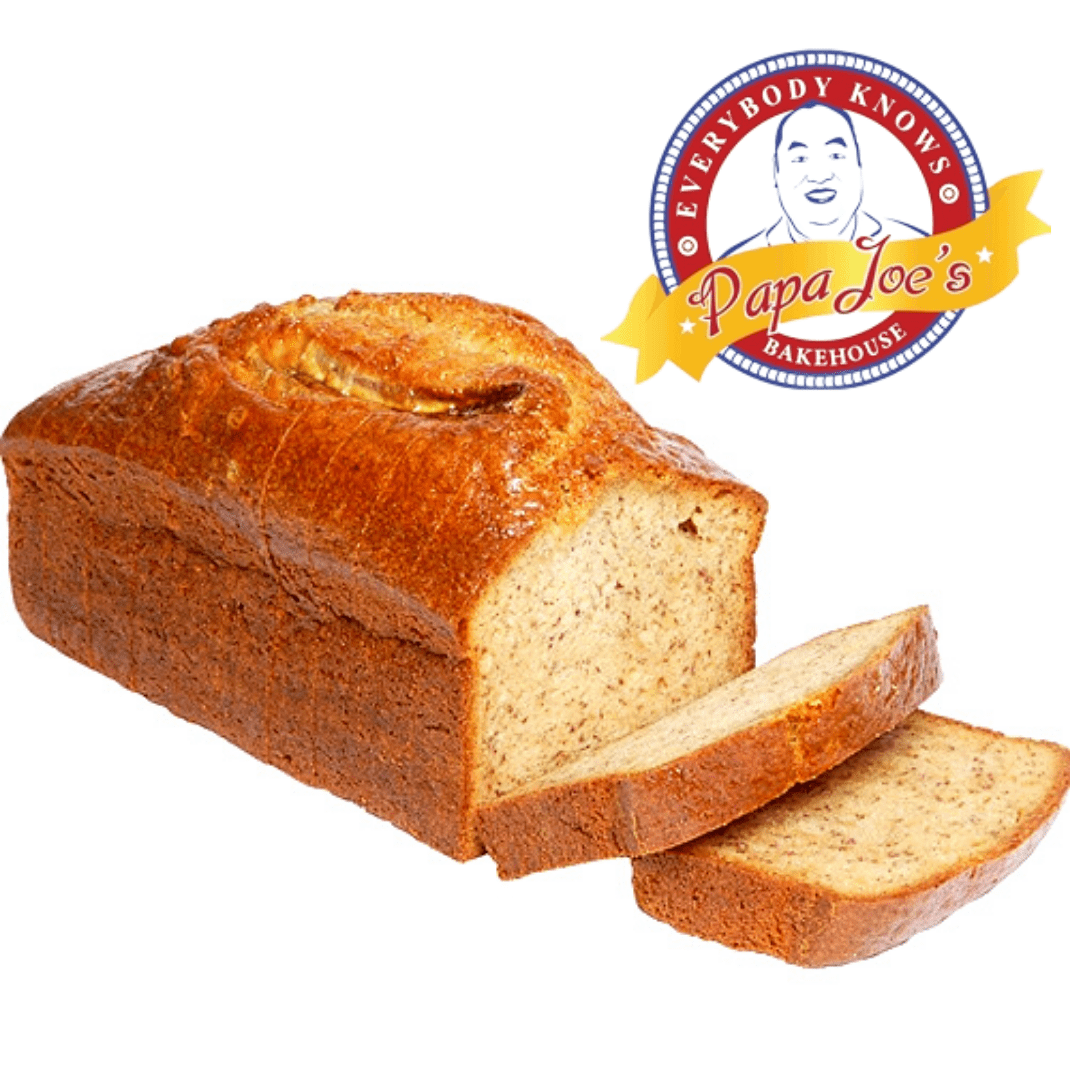 Loaf of banana bread with slices cut, Papa Joe's Bakehouse logo visible.