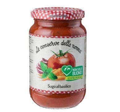 Jar of basil tomato sauce with checkered lid and illustrated label of tomatoes, basil, onions.