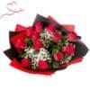 Bouquet of red roses and white flowers in black and red wrap with red heart corner design.