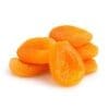 Small pile of bright orange dried apricots on a plain white background.