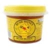 Plastic container of Bush Honey with yellow lid, Australian map, bee graphics, and honeycomb design.