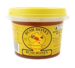 Plastic container of Bush Honey with yellow lid, Australian map, bee graphics, and honeycomb design.