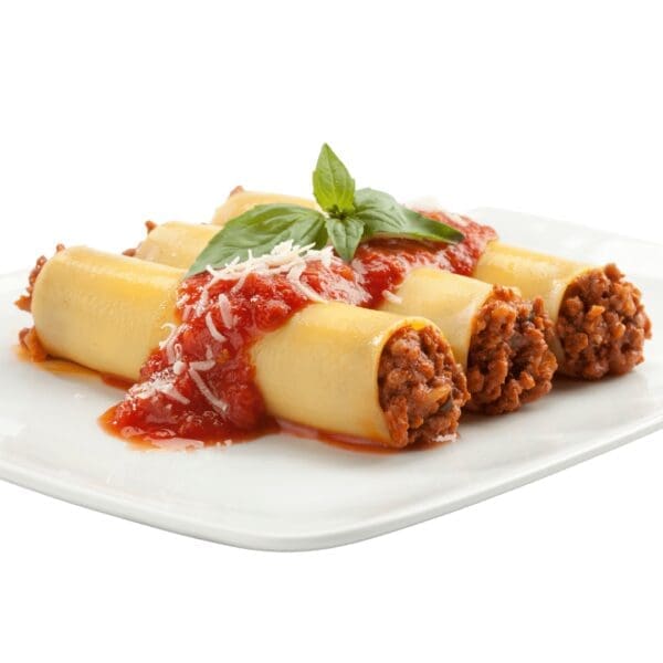 Cannelloni with meat filling, tomato sauce, cheese, basil garnish on a white plate.