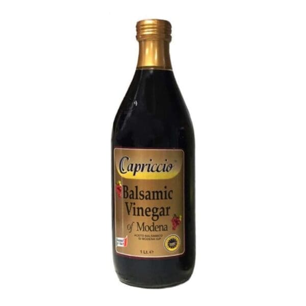 Dark bottle of Capriccio Balsamic Vinegar of Modena with gold label, 1 liter, grape images.