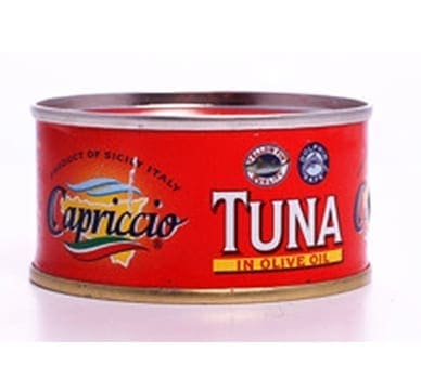 Red can of Capriccio tuna in olive oil, product of Sicily, Italy, with seal-like logos.