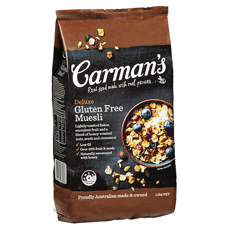 Carman's Deluxe Gluten Free Muesli bag, brown, 1.12 kg, with nuts and berries depiction.