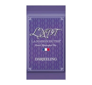 Purple packet labeled "LMDT, La Maison du Thé," with Darjeeling tea design and French flag.