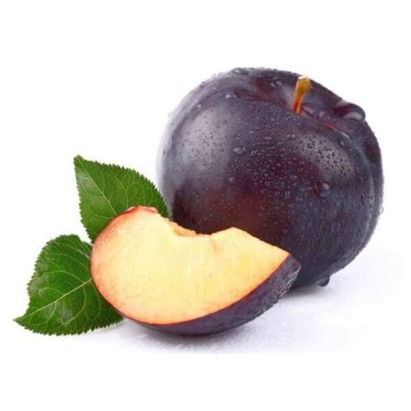 Dark purple plum with droplets and a slice showing juicy yellow-orange flesh; two green leaves.