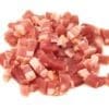 Small diced bacon pieces, uncooked, showing pink meat and white fat on a white background.