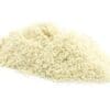 Pile of finely ground light-colored breadcrumbs on a plain white background.