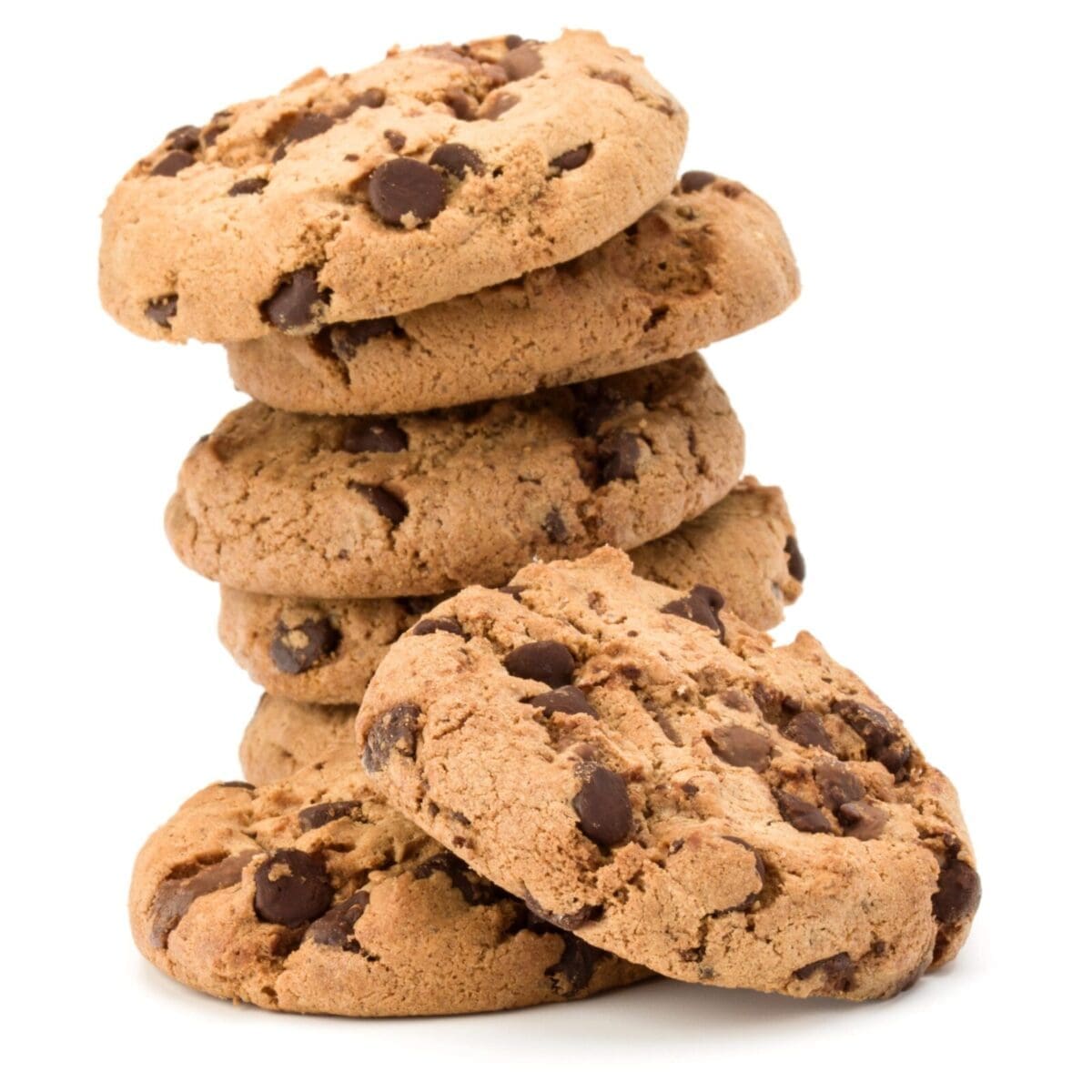 Stack of six golden-brown chocolate chip cookies on white background.