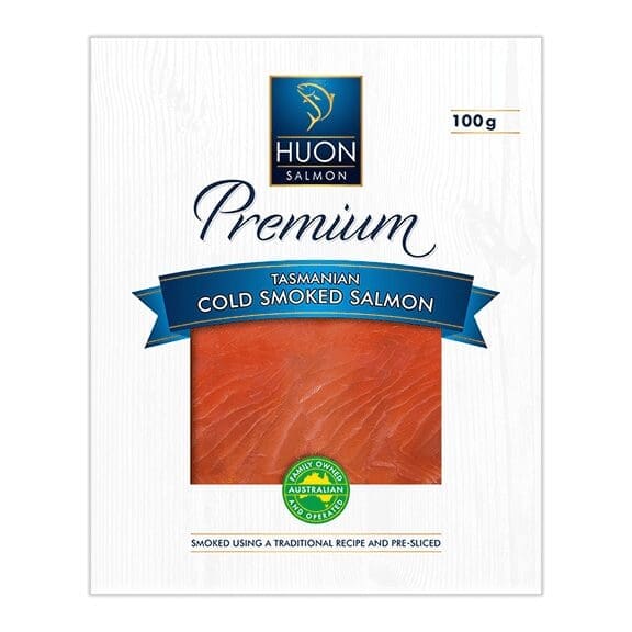 100g package of Huon Tasmanian cold smoked salmon, pre-sliced in white and blue packaging.
