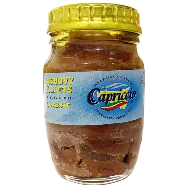 Glass jar of Italian anchovy fillets in olive oil with a yellow lid and blue label.