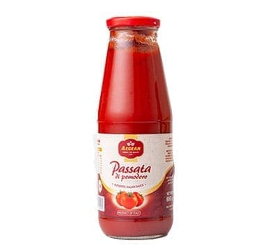 Glass bottle of Italian tomato passata with red cap and labeled branding, tomatoes illustrated.
