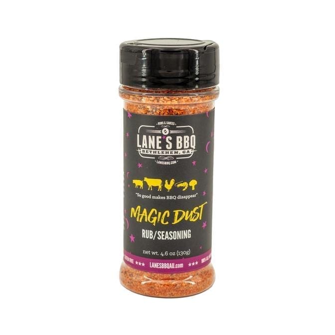 Lane's BBQ Magic Dust Rub seasoning bottle, 4.6 oz, dark label with meat icons.