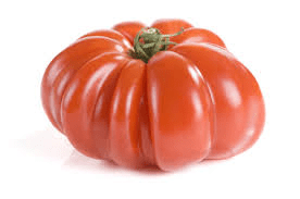 Large ripe tomato with deep ribs, vibrant red color, and small green stem on top.