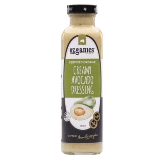 Bottle of Ozganics organic creamy avocado dressing, 350ml, with black cap and avocado images.