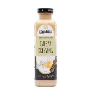 Ozganics Certified Organic Caesar Dressing bottle with garlic and lemon design.