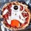 Packaged Diavola pizza with salami, cheese, charred crust, "400 Gradi" brand packaging.