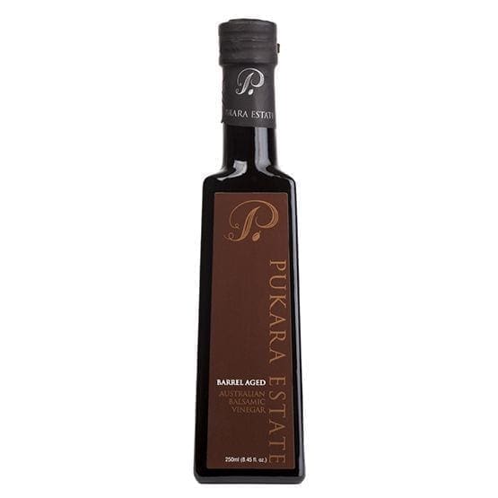 Dark glass bottle labeled "Pukara Estate" of barrel-aged Australian balsamic vinegar.