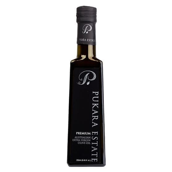 Dark glass bottle of Pukara Estate 250ml Premium Australian Extra Virgin Olive Oil with logo.