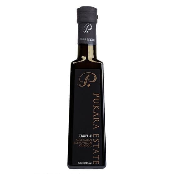 Bottle of Pukara Estate Truffle Extra Virgin Olive Oil, dark with vertical label and black cap.