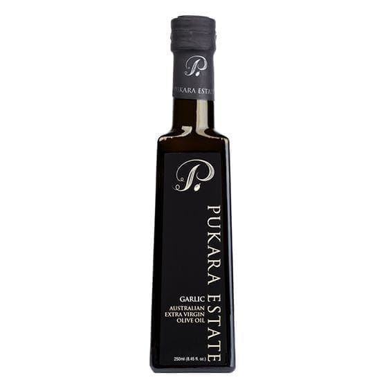 Dark bottle of Pukara Estate garlic flavored Australian extra virgin olive oil, 250ml.