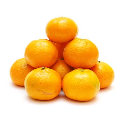 Pyramid of nine ripe oranges on a white background; bright color and smooth skins.