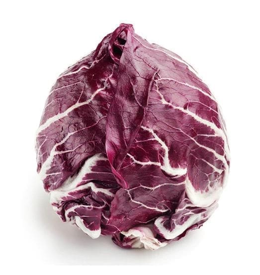 Radicchio head with deep red-purple leaves and white veins on a white background.