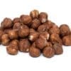 Pile of raw hazelnuts with brown shells on a white background.