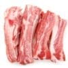 Raw pork ribs with red meat and white fat, arranged parallel, indicating they are uncooked.