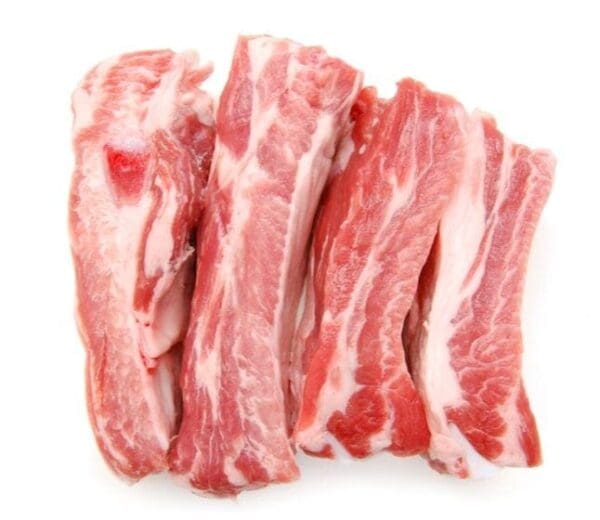 Raw pork ribs with red meat and white fat, arranged parallel, indicating they are uncooked.